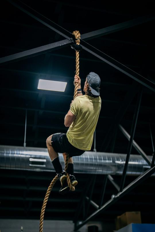 Pull-ups in a dark gym